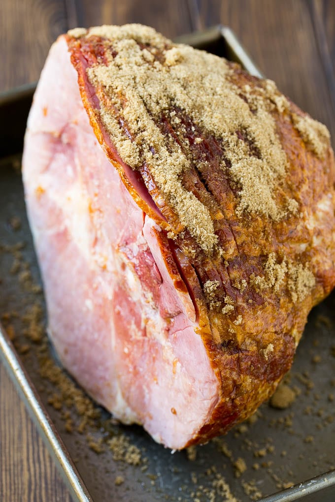 Coca Cola Ham | Coke Glazed Ham | Easter Ham | Christmas Ham | Holiday Ham Recipe #ham #easter #christmas #dinner #sraye A spiral glazed ham coated in brown sugar.