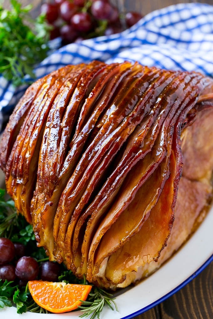 Coca Cola Ham | Coke Glazed Ham | Easter Ham | Christmas Ham | Holiday Ham Recipe #ham #easter #christmas #dinner #sraye A whole spiral cut coca cola ham on a platter.