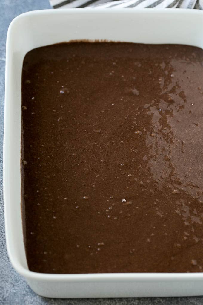 Earthquake Cake Recipe | Chocolate Cake Recipe | Chocolate Coconut Cake | Coconut Pecan Cake #cake #chocolate #coconut #pecans #dessert #chocolatecake #sraye Chocolate cake batter in a baking dish.