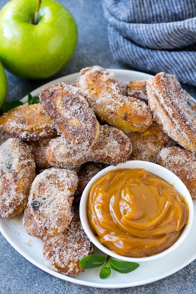 Apple Fries Recipe | Fried Apples Recipe | Cinnamon Sugar Apples | Apple Dessert Recipe #apples #dessert #sraye #fall A pile of cinnamon sugar apple fries with caramel sauce for dipping.