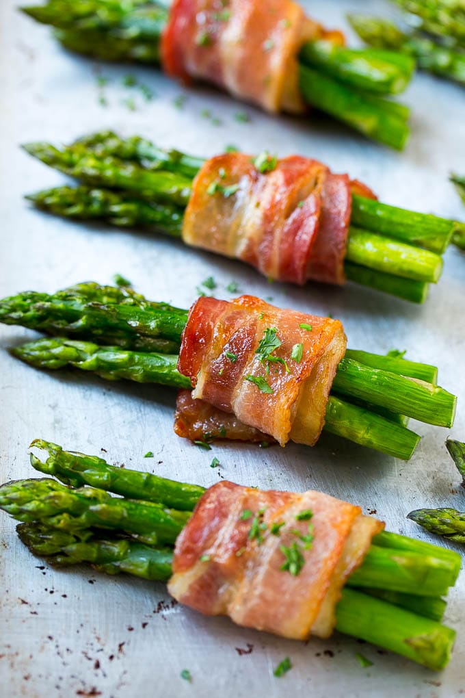 Bacon Wrapped Asparagus Recipe | Roasted Asparagus | Asparagus Side Dish #asparagus #bacon #sidedish #dinner #sraye Roasted asparagus in bundles on a sheet pan.