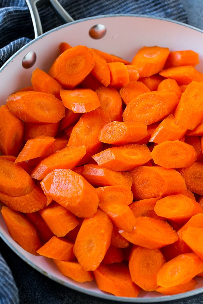 Candied Carrots Recipe | Carrot Side Dish | Brown Sugar Carrots | Glazed Carrots #carrots #brownsugar #sidedish #dinner #sraye Raw sliced carrots in a pan.