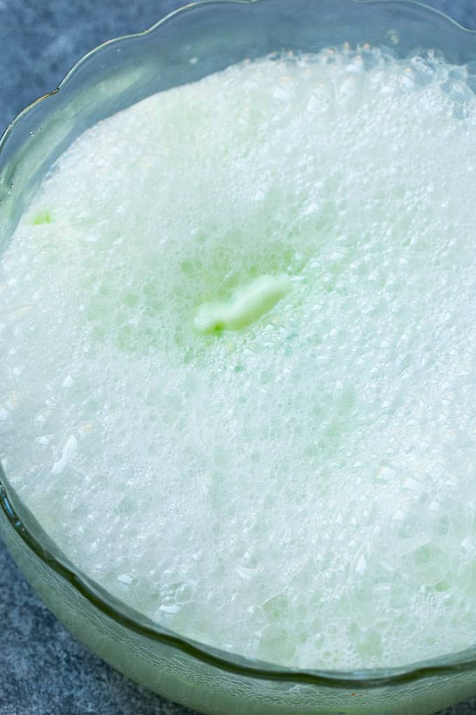 Lime Sherbet Punch | Party Punch Recipe | Sherbet Punch Recipe | Limeade Recipe #sherbet #punch #lime #drink #sraye Soda that has been poured into a large bowl.