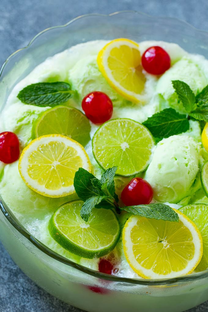 Lime Sherbet Punch | Party Punch Recipe | Sherbet Punch Recipe | Limeade Recipe #sherbet #punch #lime #drink #sraye Sherbet punch garnished with cherries, lemons, limes and mint.