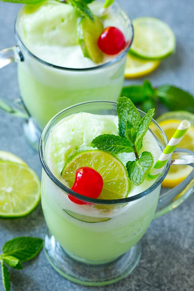 Lime Sherbet Punch | Party Punch Recipe | Sherbet Punch Recipe | Limeade Recipe #sherbet #punch #lime #drink #sraye Cups of sherbet punch with straws.