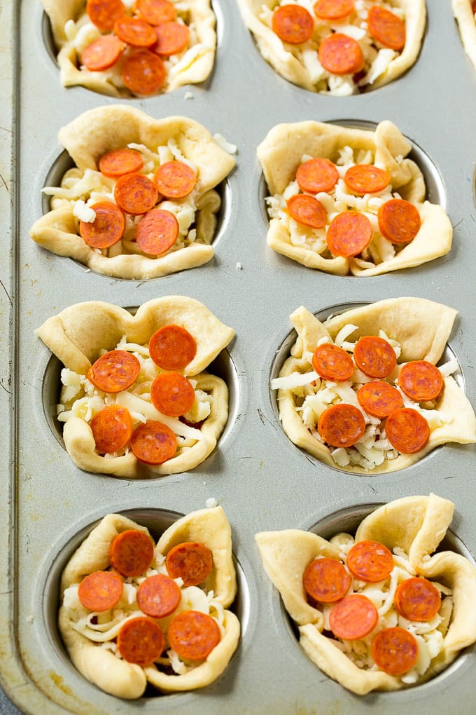 Pizza Muffins Recipe | Pizza Bites | Pizza Cups | Pizza Appetizer #pizza #appetizer #sraye Unbaked dough cups filled with cheese, sauce and pepperoni.