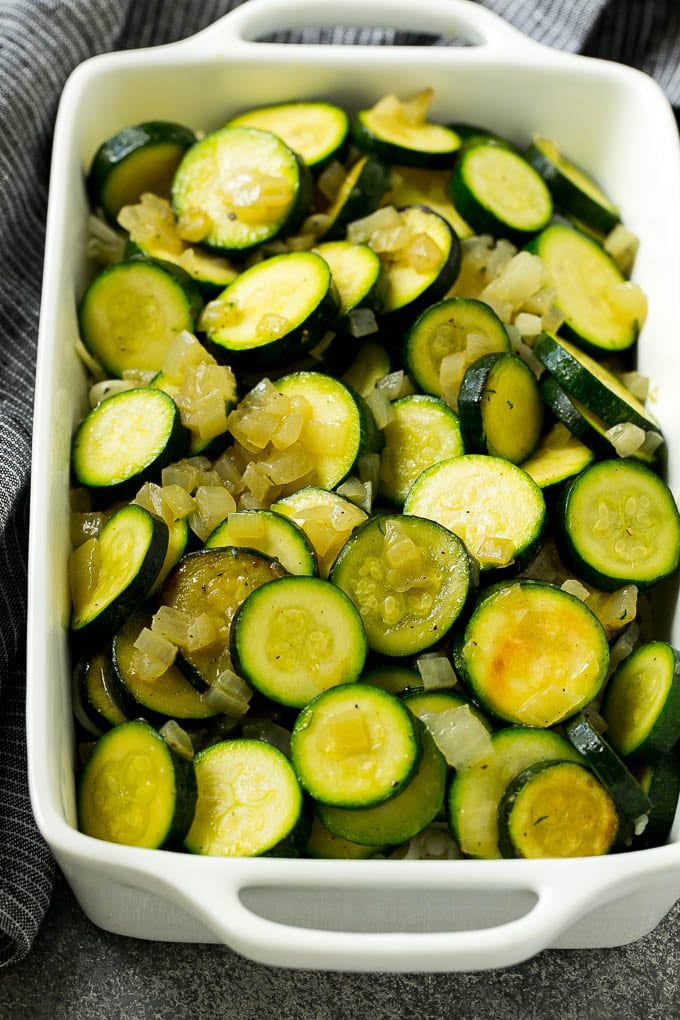 Zucchini Gratin Recipe | Cheesy Zucchini | Baked Zucchini | Easy Zucchini Recipe #zucchini #casserole #cheese #dinner #sidedish #sraye Sauteed zucchini and onions in a baking dish.