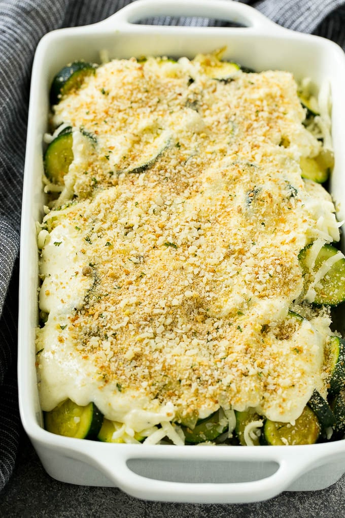 Zucchini Gratin Recipe | Cheesy Zucchini | Baked Zucchini | Easy Zucchini Recipe #zucchini #casserole #cheese #dinner #sidedish #sraye Zucchini gratin with layers of cheese, sauce and breadcrumbs, ready to go into the oven.