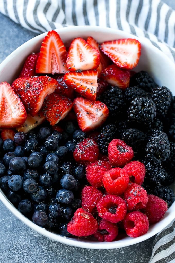 Berry Fruit Salad Recipe | Berry Salad | Summer Berry Salad | Fruit Salad Recipe #berries #fruitsalad #sraye A bowl of blueberries, raspberries, blackberries and strawberries topped with poppy seed dressing.