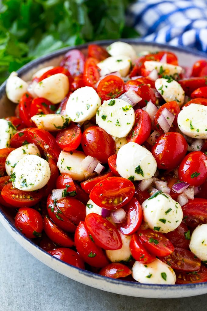 Cherry Tomato Salad Recipe | Tomato Mozzarella Salad | Caprese Salad | Tomato Salad #tomatoes #salad #tomatosalad #caprese #sraye Cherry tomato salad with halved cherry tomatoes, mozzarella balls and red onion, all tossed with herbs and dressing.