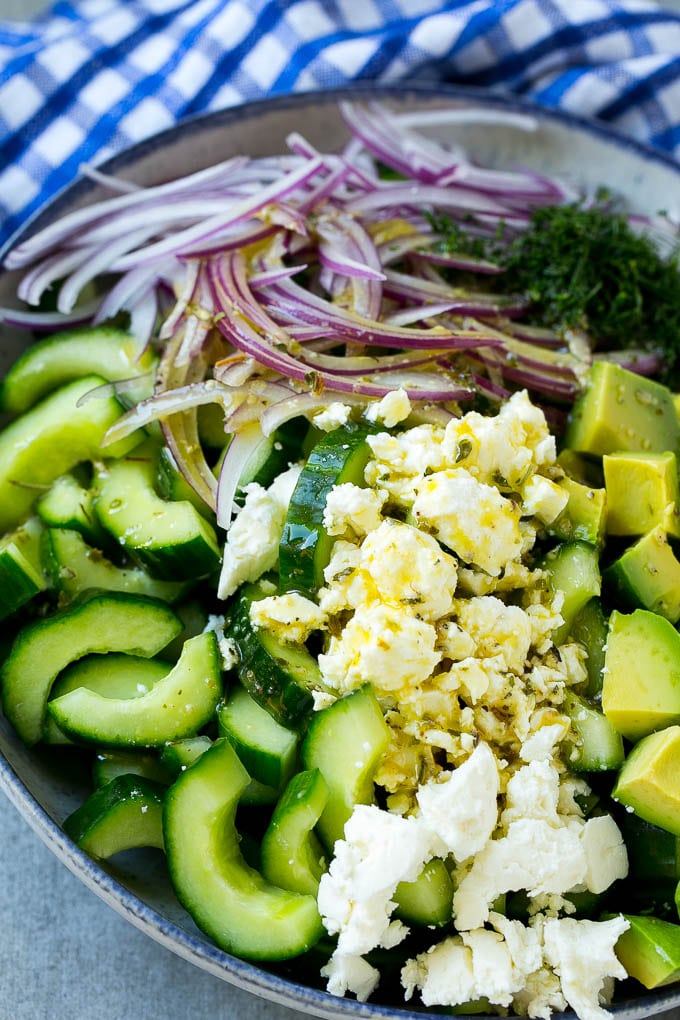 Cucumber Feta Salad Recipe | Cucumber Salad | Feta Cheese Salad | Summer Salad #salad #cucumber #sraye Veggies and cheese topped with Greek dressing.