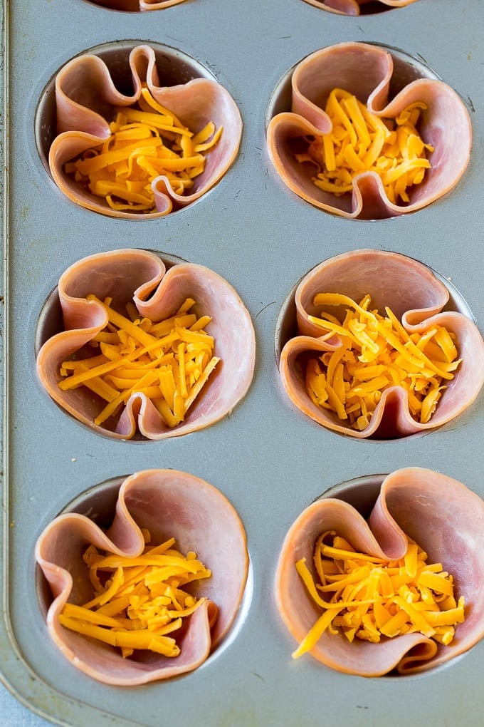 Ham and Egg Cups Recipe | Low Carb Breakfast | Ham and Eggs #ham #eggs #lowcarb #breakfast #sraye Ham pressed into muffin tins and topped with shredded cheese.