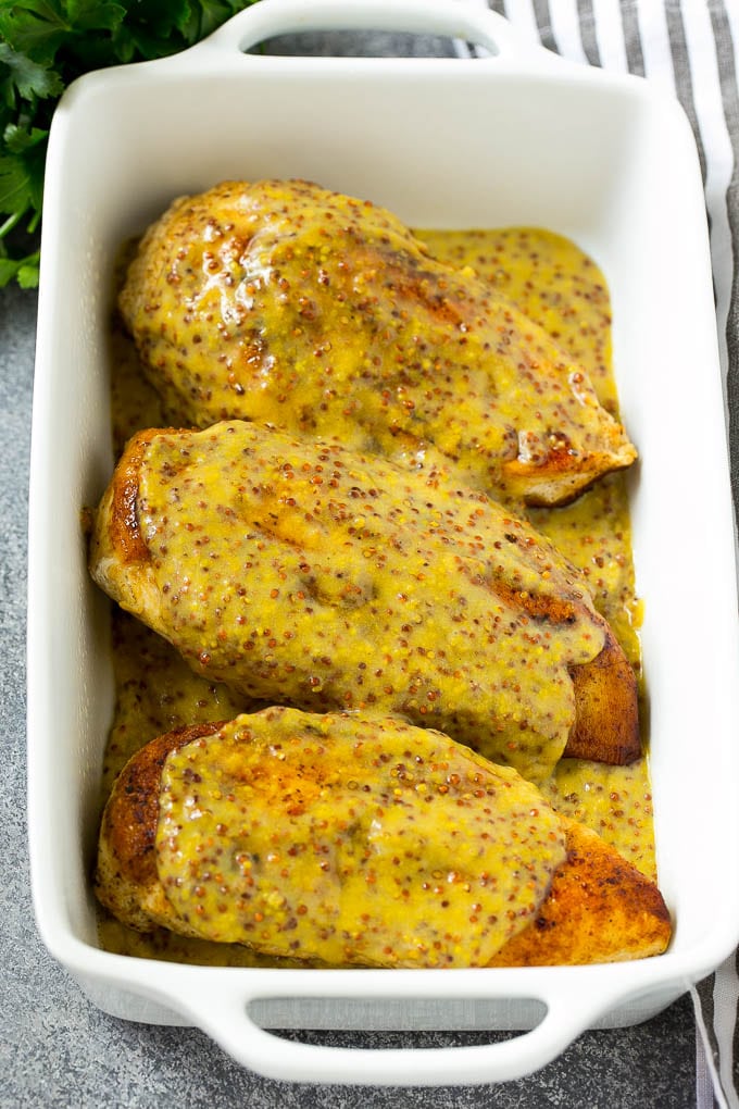 Honey Mustard Chicken Recipe | Baked Chicken Recipe | Easy Chicken Recipe #chicken #dinner #sraye Chicken breasts in a baking dish topped with sauce.