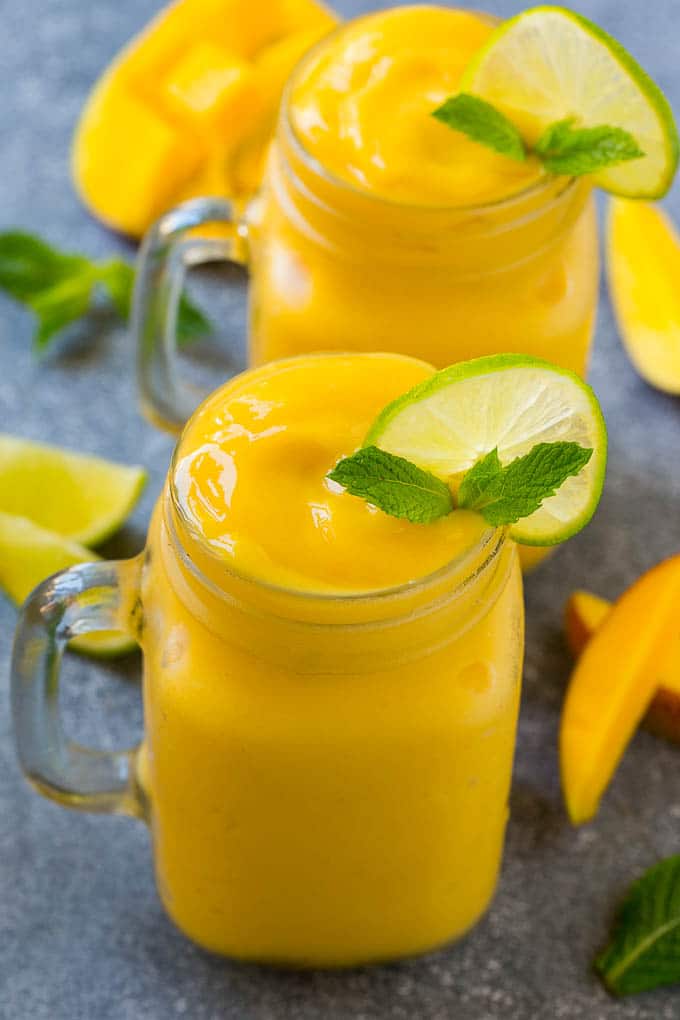 Mango Smoothie Recipe | Mango Recipe | Healthy Smoothie #mango #smoothie #drink #sraye Mango smoothie in a mason jar mug.