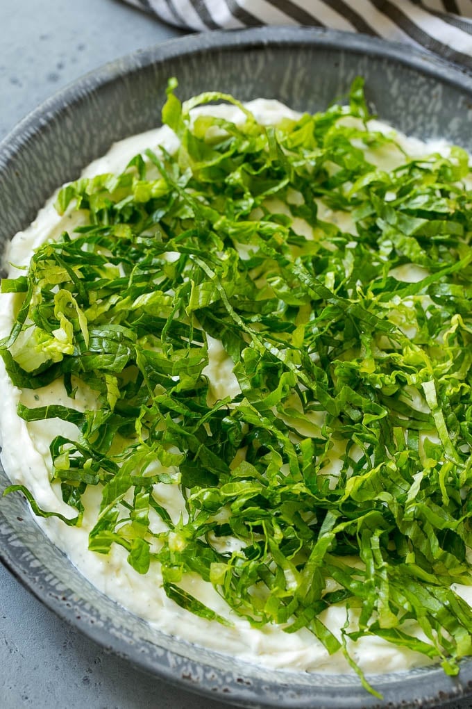 BLT Dip Recipe | Bacon Dip Recipe | Ranch Dip #dip #ranch #bacon #lettuce #tomato #appetizer #sraye Shredded romaine lettuce over a sour cream, cream cheese and ranch powder base.