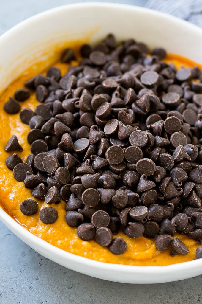 Pumpkin Chocolate Chip Cookies Recipe | Pumpkin Cookies | Pumpkin Chocolate Cookies #pumpkin #cookies #chocolate #baking #fall #sraye #dessert Batter with chocolate chips on top in a bowl.