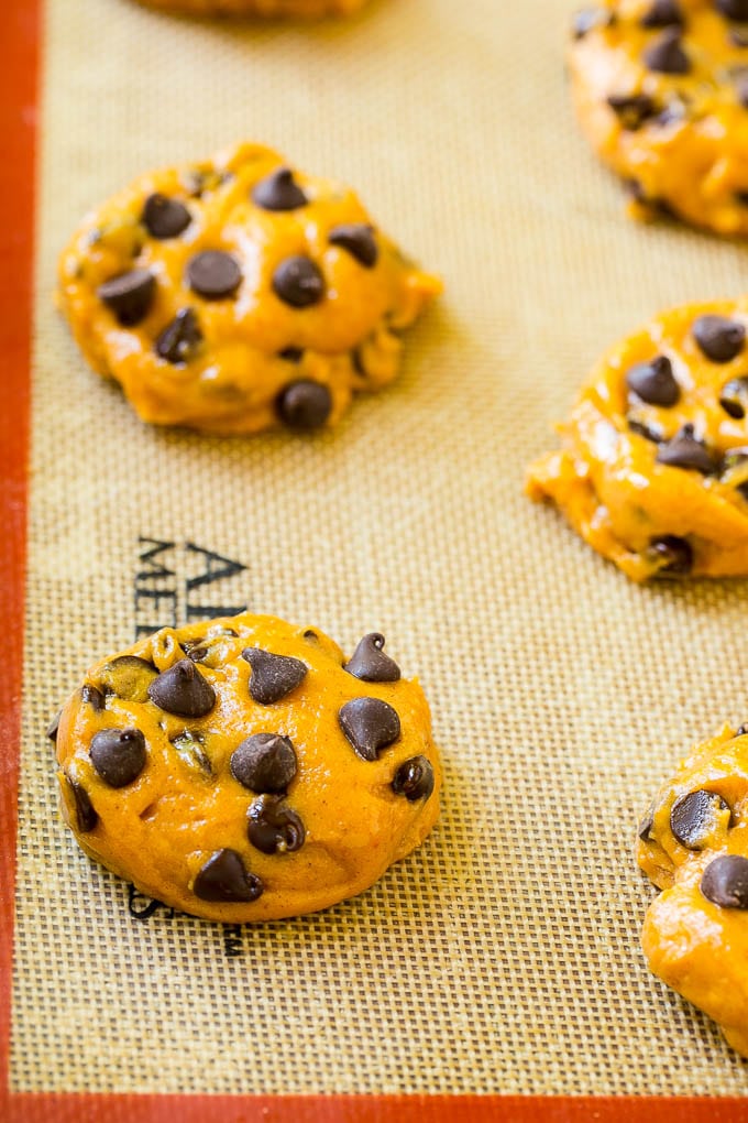 Pumpkin Chocolate Chip Cookies Recipe | Pumpkin Cookies | Pumpkin Chocolate Cookies #pumpkin #cookies #chocolate #baking #fall #sraye #dessert Dollops of dough on a baking sheet.