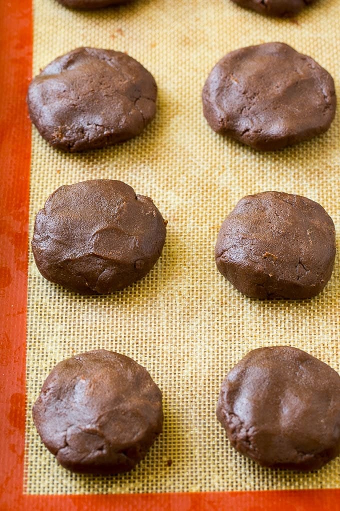 Nutella Cookies Recipe | Nutella Stuffed Cookies | Chocolate Cookies #nutella #chocolate #cookies #baking #dessert #sraye Nutella cookie dough on a baking sheet.