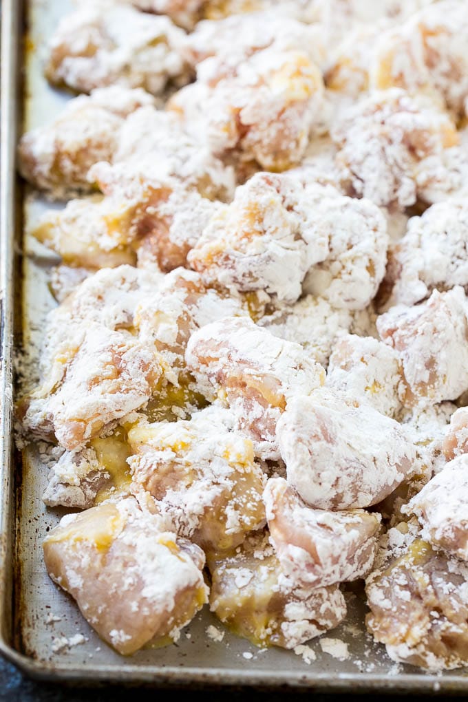 Orange Chicken Recipe | Chinese Orange Chicken | Panda Express Orange Chicken #orange #chicken #takeout #chinesefood #dinner #sraye Chicken pieces coated in egg and flour.