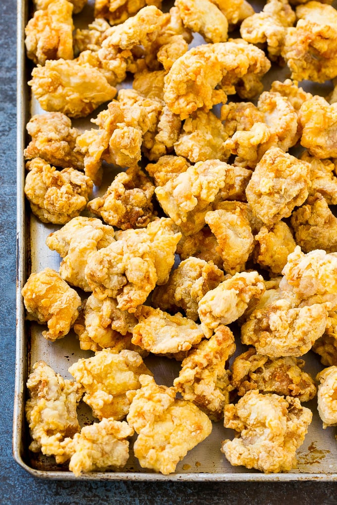 Orange Chicken Recipe | Chinese Orange Chicken | Panda Express Orange Chicken #orange #chicken #takeout #chinesefood #dinner #sraye Crispy fried chicken on a sheet pan.