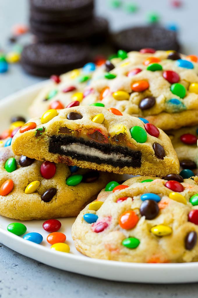 Oreo Stuffed Cookies Recipe | M&M's cookies | Stuffed Cookies #cookies #chocolate #oreos #dessert #baking #sraye A plate of Oreo stuffed cookies topped with miniature M&M's.