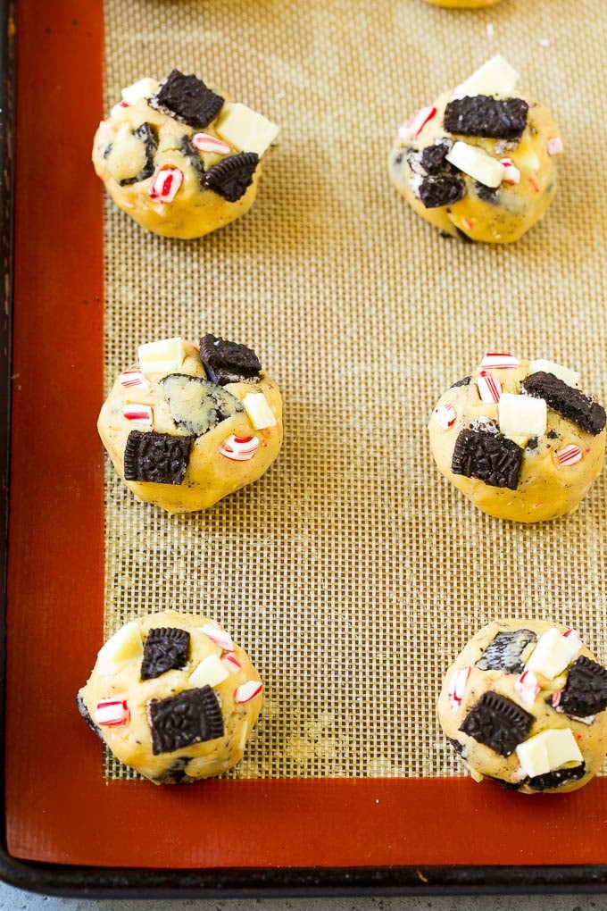 Oreo Peppermint Cookies Recipe | Candy Cane Cookies | Oreo Cookies #oreo #peppermint #cookies #baking #Christmas #sweets #sraye A sheet pan of unbaked cookies.