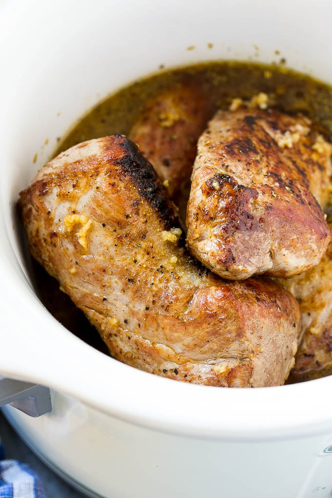 Slow Cooker Pork Tenderloin Recipe | Crock Pot Pork Tenderloin | Easy Pork Tenderloin #slowcooker #crockpot #pork #dinner #sraye Seared pork tenderloin in a slow cooker with seasonings.