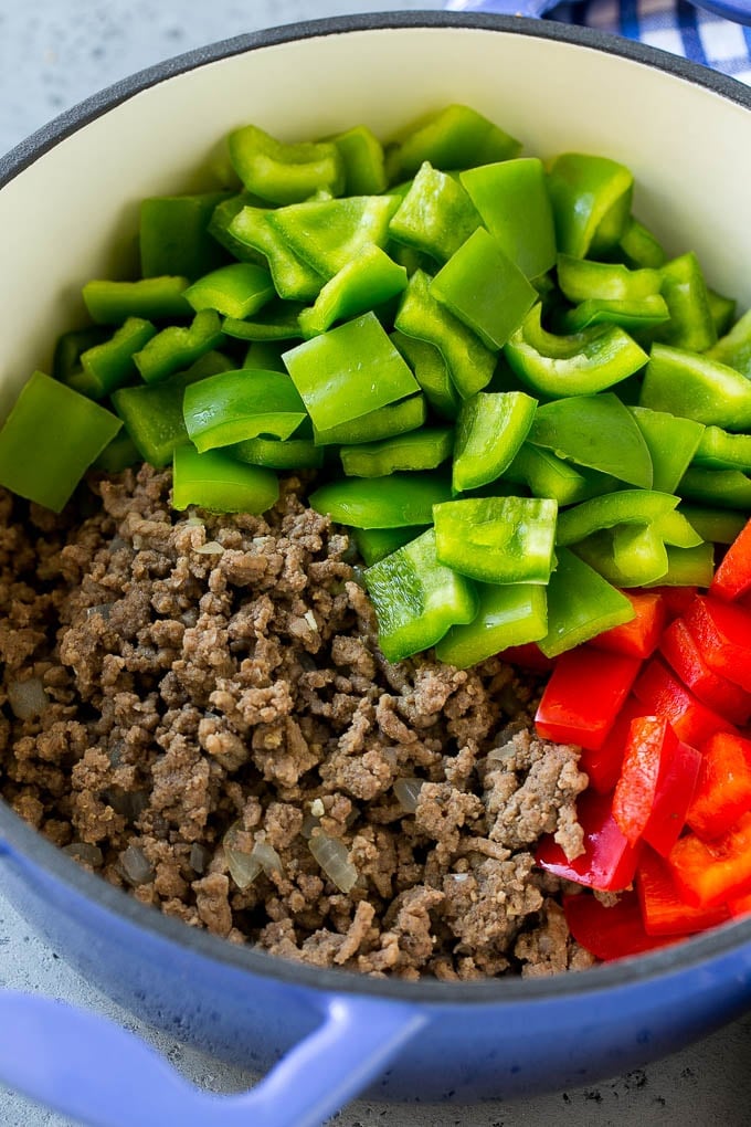 Stuffed Pepper Soup Recipe | Beef and Rice Soup | Stuffed Peppers #peppers #soup #beef #rice #dinner #sraye Cooked ground beef and bell peppers in a soup pot.