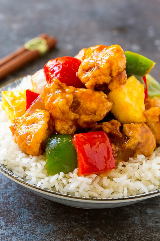 Sweet and Sour Chicken Recipe | Chinese Food Copycat Recipe | Chicken with Pineapple #chicken #chinesefood #pineapple #stirfry #takeout #dinner #sraye A bowl of sweet and sour chicken, served over steamed rice.