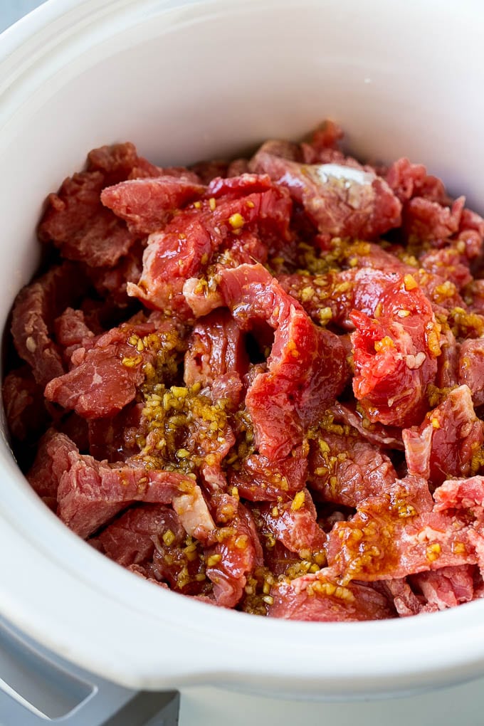 Slow Cooker Korean Beef Recipe | Korean Beef | Flank Steak Recipe #dinner #beef #slowcooker #crockpot #asian #sraye Flank steak strips in a soy, ginger and garlic sauce.
