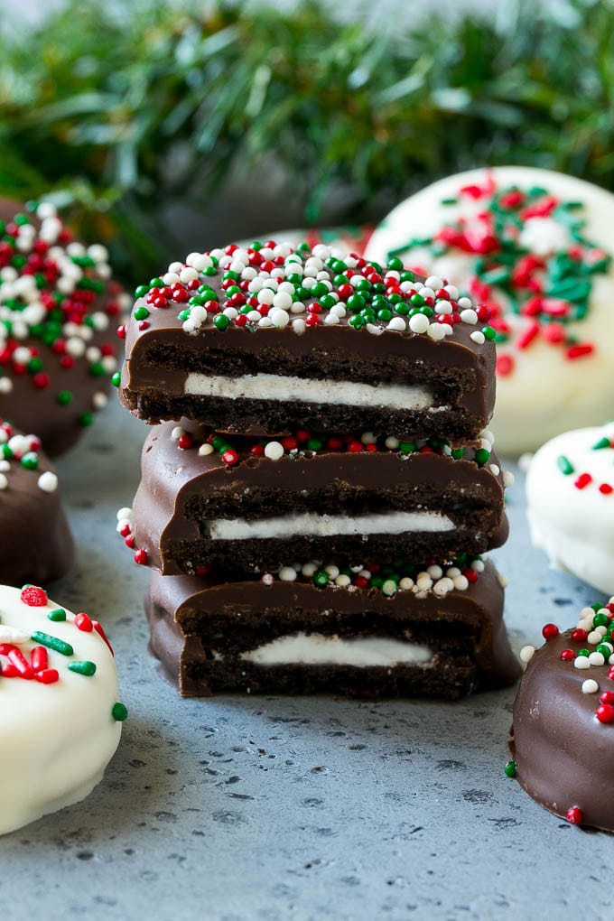 Chocolate Covered Oreos Recipe | Oreo Cookies | Chocolate Dipped Oreos #oreo #cookies #chocolate #sprinkles #dessert #sraye A stack of chocolate covered Oreos.
