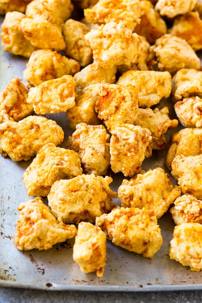 Sweet Chili Chicken Recipe | Thai Chicken | Asian Chicken #chicken #thaifood #chili #dinner #sraye Fried chicken breast pieces on a sheet pan.