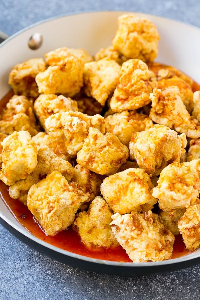 Sweet Chili Chicken Recipe | Thai Chicken | Asian Chicken #chicken #thaifood #chili #dinner #sraye Crispy chicken breast pieces with sweet chili sauce in a pan.