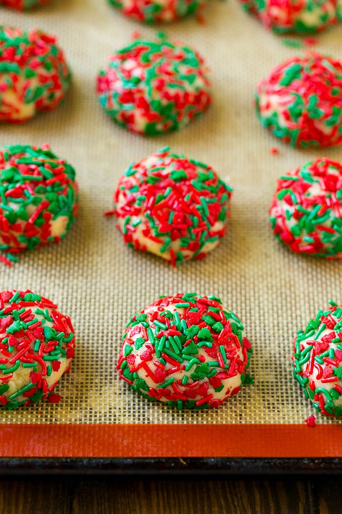 Cake Mix Cookies Recipe | Sprinkle Cookies | Christmas Cookies #cookies #christmas #sprinkles #dessert #baking #sraye Balls of dough rolled in sprinkles.