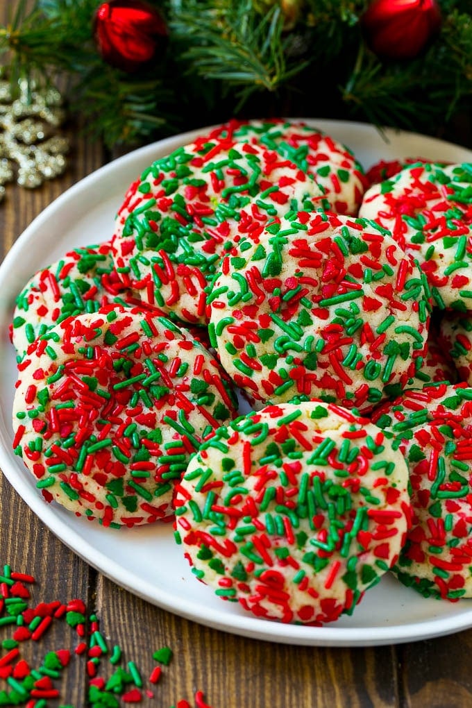 Cake Mix Cookies Recipe | Sprinkle Cookies | Christmas Cookies #cookies #christmas #sprinkles #dessert #baking #sraye A plate of cake mix cookies rolled in colorful sprinkles.