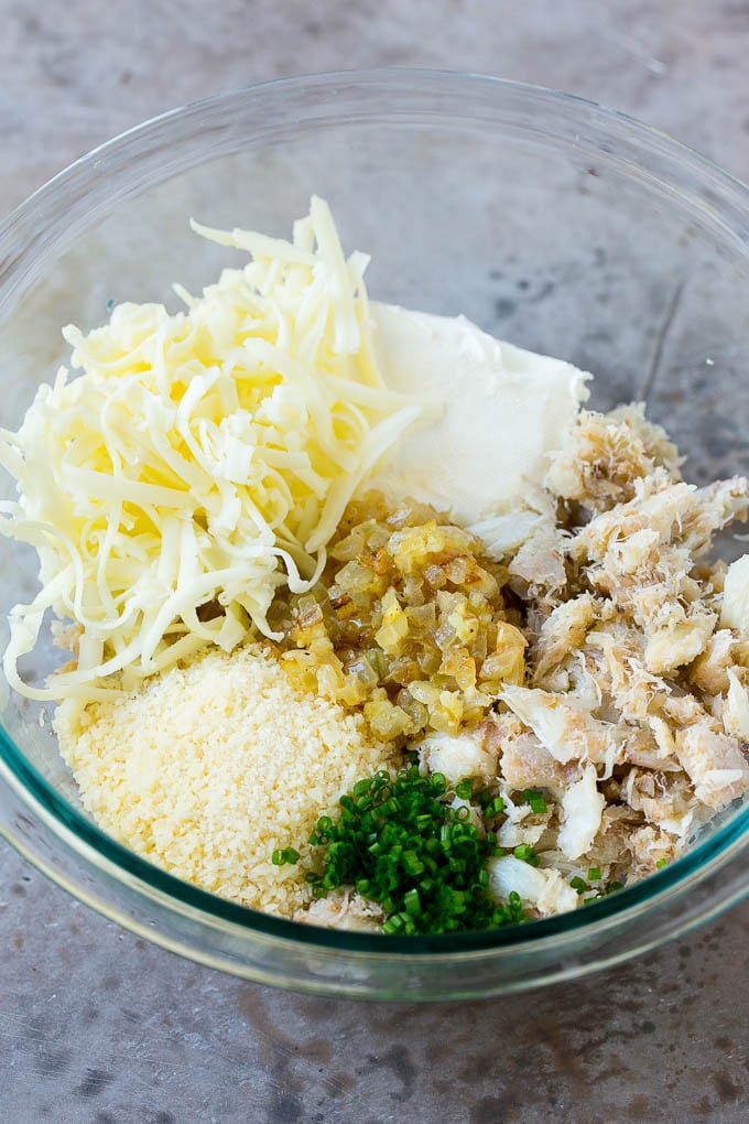 Crab Stuffed Mushrooms Recipe | Stuffed Mushrooms | Mushroom Appetizer #crab #seafood #mushrooms #lowcarb #appetizer #sraye A bowl of crab meat, cheese, chives, onions and garlic.