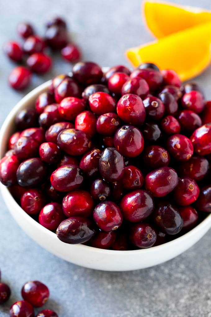 Cranberry Orange Sauce Recipe | Homemade Cranberry Sauce | Fresh Cranberry Sauce #cranberry #orange #fall #thanksgiving #sauce #dinner #sraye A bowl of fresh cranberries.