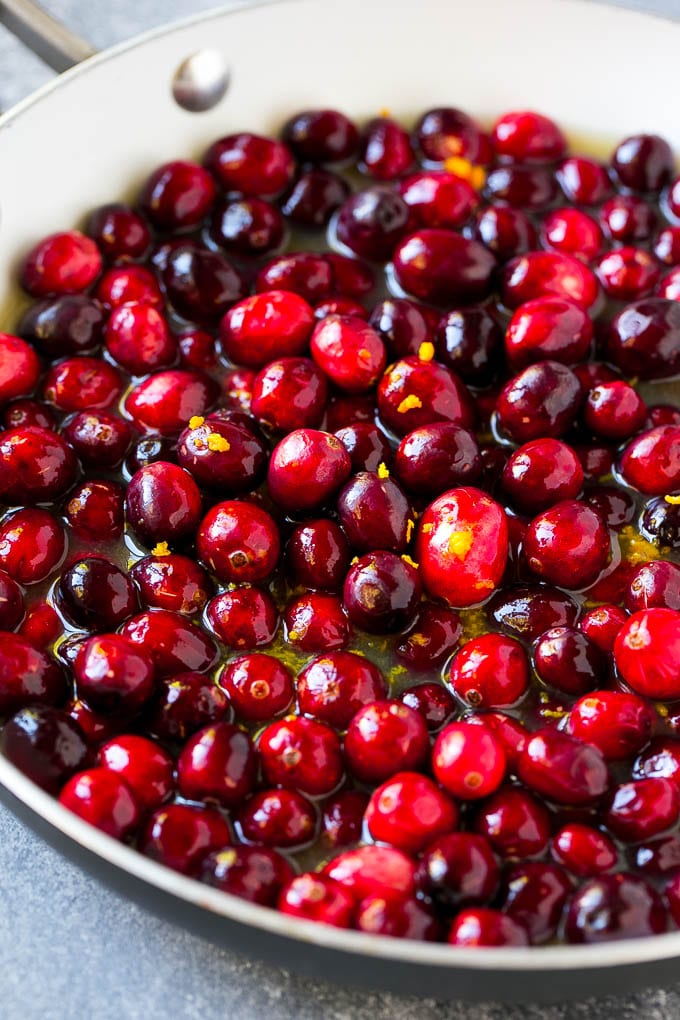 Cranberry Orange Sauce Recipe | Homemade Cranberry Sauce | Fresh Cranberry Sauce #cranberry #orange #fall #thanksgiving #sauce #dinner #sraye Berries in a skillet with orange juice, sugar and orange zest.