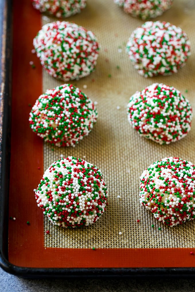 Gooey Butter Cookies Recipe | Cake Mix Cookies | Sprinkle Cookies | Christmas Cookies #cookies #butter #sprinkles #christmas #dessert #baking #sraye Balls of dough rolled in sprinkles.