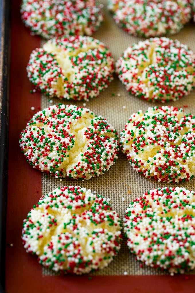 Gooey Butter Cookies Recipe | Cake Mix Cookies | Sprinkle Cookies | Christmas Cookies #cookies #butter #sprinkles #christmas #dessert #baking #sraye Baked gooey butter cookies on a sheet pan.