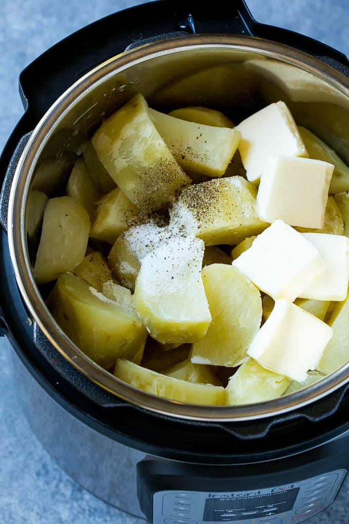 Instant Pot Mashed Potatoes Recipe | Pressure Cooker Mashed Potatoes | Easy Mashed Potatoes #potatoes #sidedish #instantpot #thanksgiving #dinner #sraye Cooked chunks of potatoes with butter, milk and seasonings in an Instant Pot.