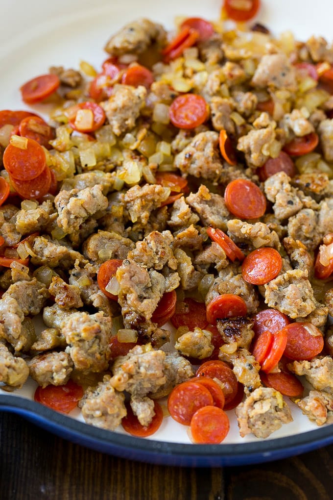 Pizza Pasta Recipe | Pepperoni Pasta | Sausage Pasta #italian #pepperoni #sausage #pizza #pasta #dinner #sraye #onepot A pan of cooked sausage, pepperoni and onions.