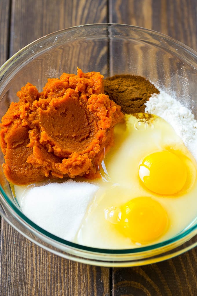 Pumpkin Chocolate Chip Bread Recipe | Pumpkin Bread | Chocolate Pumpkin Bread #pumpkin #bread #fall #chocolate #baking #dessert #sraye Sugar, eggs, pumpkin puree, flour and spices in a mixing bowl.