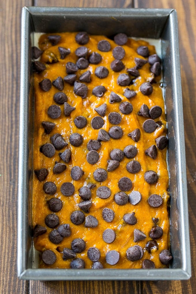 Pumpkin Chocolate Chip Bread Recipe | Pumpkin Bread | Chocolate Pumpkin Bread #pumpkin #bread #fall #chocolate #baking #dessert #sraye A loaf pan of pumpkin chocolate chip bread batter.