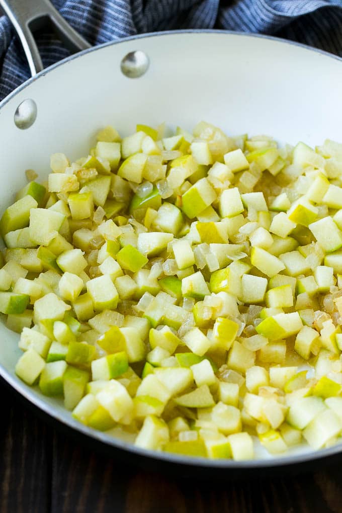 Wild Rice Pilaf Recipe | Thanksgiving Side Dish | Rice Pilaf #rice #apple #cranberry #fall #glutenfree #thanksgiving #sraye Sauteed onions and apples in a skillet.