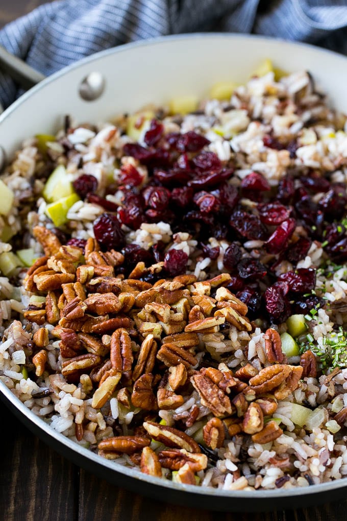 Wild Rice Pilaf Recipe | Thanksgiving Side Dish | Rice Pilaf #rice #apple #cranberry #fall #glutenfree #thanksgiving #sraye Apples and wild rice topped with dried cranberries, pecans and herbs.