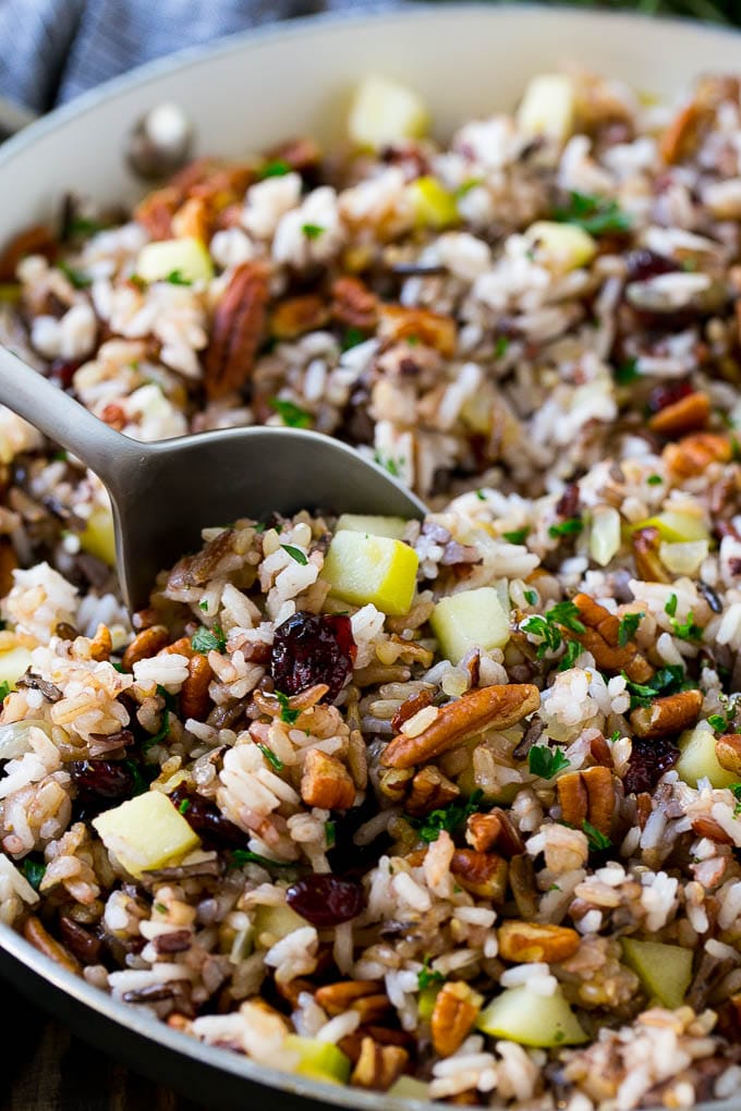 Wild Rice Pilaf Recipe | Thanksgiving Side Dish | Rice Pilaf #rice #apple #cranberry #fall #glutenfree #thanksgiving #sraye A skillet of rice pilaf with apples, cranberries and pecans.