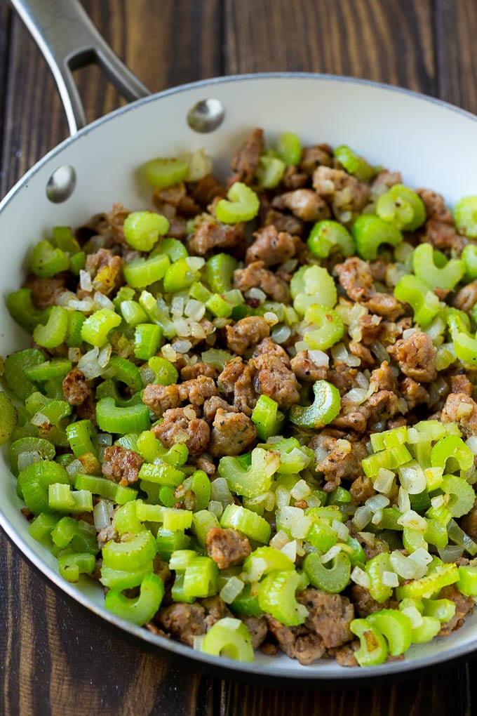 Sausage Stuffing Recipe | Thanksgiving Stuffing | Make Ahead Stuffing #stuffing #thanksgiving #sausage #sidedish #dinner #sraye A pan of cooked sausage, celery and onions.