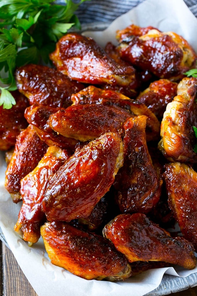Smoked Chicken Wings | Barbecue Chicken Wings | BBQ Chicken Wings #chicken #wings #bbq #barbecue #appetizer #dinner #sraye Smoked chicken wings brushed with homemade BBQ sauce on a serving plate.
