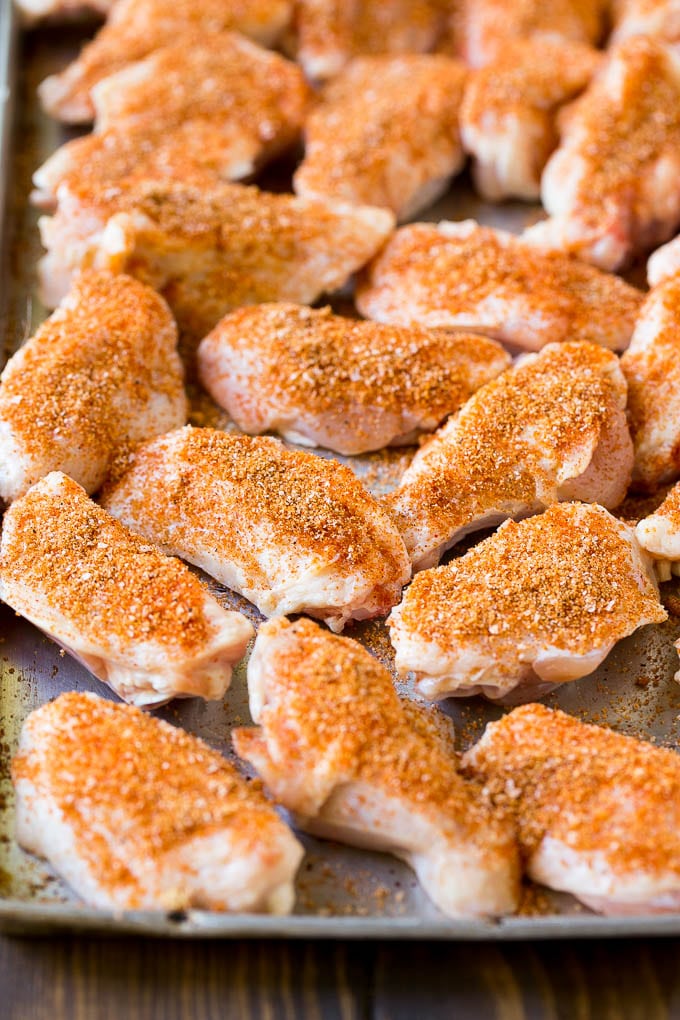 Smoked Chicken Wings | Barbecue Chicken Wings | BBQ Chicken Wings #chicken #wings #bbq #barbecue #appetizer #dinner #sraye Raw chicken wings coated in homemade spice rub on a sheet pan.